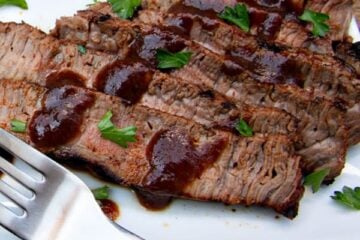 A white plate with spice-rubbed sirloin cut