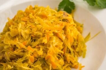 A white plate of Russian braised cabbage