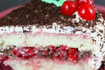 A must try Russian Cherry Layer Cake with a surprise layer inside. The frosting has only 2 ingredients. This cake was a winner!