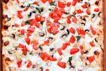 A large chicken pizza with creamy garlic sauce