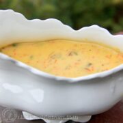 A white, gravy bowl with mushroom gravy