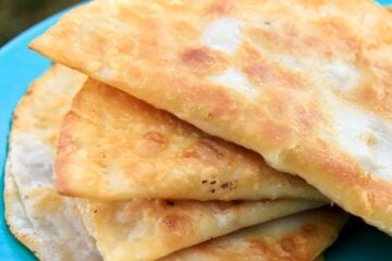 A blue plate with Lena's chebureki on the plate