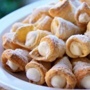 These puff pastry cream horns are easy and impressive for any special occasion! This is my Mother's cream horns recipe (aka trubochki).