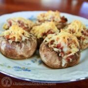These mushrooms are stuffed with a mix of cheeses, bacon and onion and are baked to perfection. This recipe is quite scrumptious!