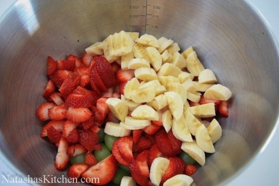 Bananas, strawberries and grapes in a bowl