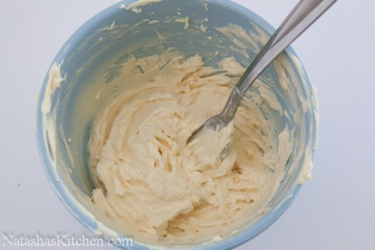 Mixture for canap&eacute;s with eggs and chives in a blue bowl 