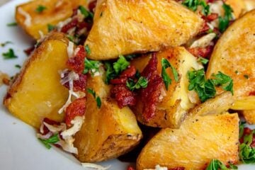 Oven-roasted potatoes with bacon and cheese in a plate