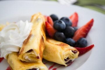 These Russian Crepes with cheese are our favorite breakfast and they can be prepared ahead of time; making it the ideal breakfast dish for company.