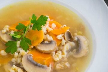 A bowl of barley and mushroom soup