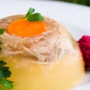 Ukrainian aspic, kholodets, on a white plate