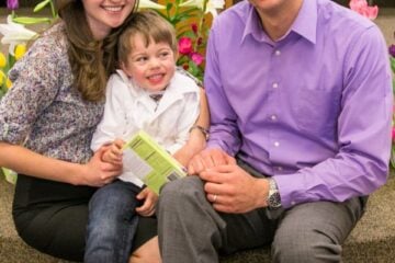 Natasha and her family smiling at the camera at church