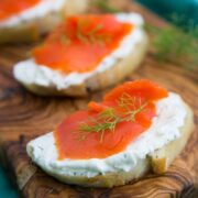 These smoked salmon tea sandwiches (crostini) show up at 90% of our parties. Everyone loves them. The cream cheese dill spread is wonderful!