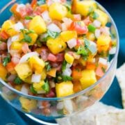 Not only this Fresh Peach Salsa is it yummy as an appetizer with chips, it's also really good as a topping for fish or pork; who would have thought?