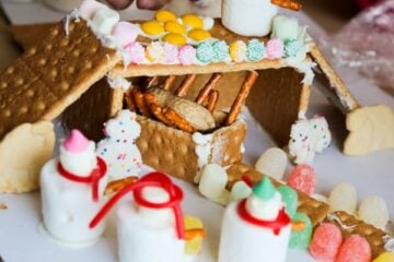 A gingerbread house being put together