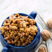 These caramelized, candied walnuts are quite a treat. Toss them into your salad, over popcorn, or straight into your mouth. Crunch. Crunch.