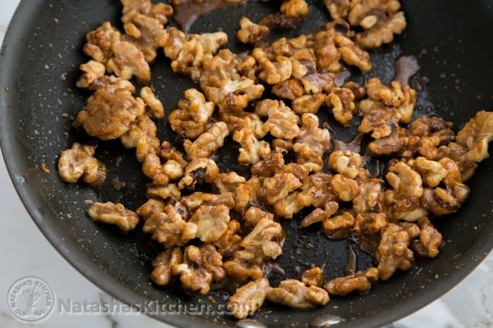 Candied walnuts cooked in a skillet