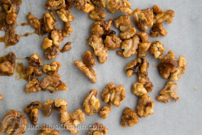 candied walnuts transfered to parchment paper 