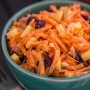 A close up of a bowl of carrot and apple salad
