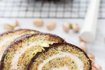 This moist poppyseed cake roll is generously filled with a cream cheese frosting, covered with velvety chocolate ganache and pummeled with salted pistachios. It&rsquo;s moist, sweet, tangy, chocolaty and a teensy bit salty. We have a winner!
