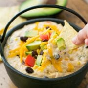 This Southwest hot chicken dip is cheesy, loaded with corn, black beans, and has just the right amount of heat from the jalape&ntilde;os. Enjoy one pot recipe!