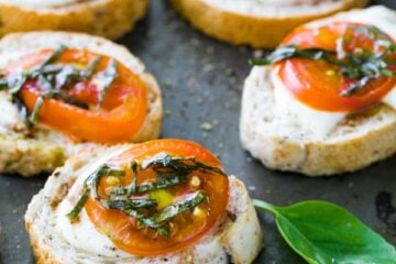Caprese Crostini are an easy and tasty appetizer to serve at parties. They only take about 10 minutes to assemble, but they look fancy and taste great.