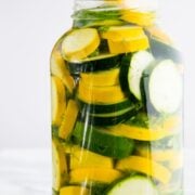 A glass jar of pickled zucchini