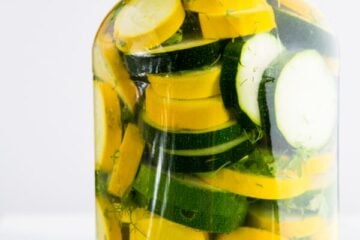 A glass jar of pickled zucchini