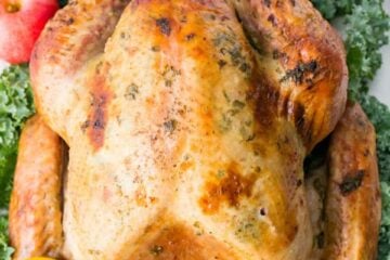 Juicy Roast Turkey on a serving platter garnished with fruit