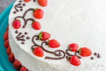 This is THE Strawberry Cake!! It calls for 1 1/2 lbs of fresh strawberries & the whipped cream cheese frosting is simple & delicious. | natashaskitchen.com