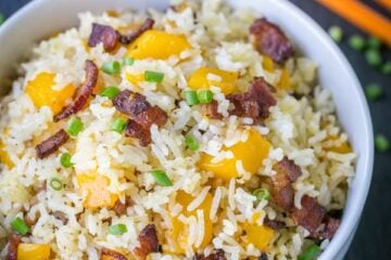 We love this bacon mango fried rice! The mango caramelizes with the crisp bacon - so good! 3 ingredients, 1 pan, 15 min | natashaskitchen.com