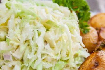 A plate with creamy apple coleslaw