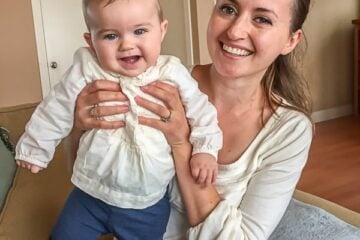 Natasha holding up her baby daughter