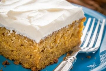 This Easy Pumpkin Cake is done in 4 steps (with frosting)! The moist, delicate crumb and marshmallow-like whipped cream cheese frosting is irresistible!