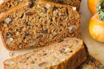 This Persimmon Bread Recipe is a keeper (in a make again and again sort of way)! Soft, moist, and every slice is studded with walnuts and raisins | natashaskitchen.com