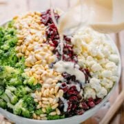 broccoli cauliflower salad drizzled with creamy dressing