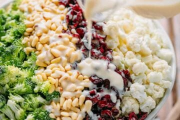 broccoli cauliflower salad drizzled with creamy dressing