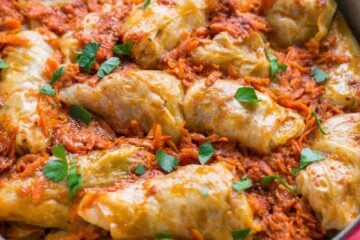 These stuffed cabbage rolls are the best I've tried! Cabbage rolls (golubtsi) are made with simple, inexpensive ingredients but are super delicious (and a freezer friendly meal!) My family loves these with sour cream and soft French bread.