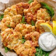 The cheese in these chicken fritters forms a crisp outer crust and a lovely cheese pull as you bite into these yummy chicken fritters. Juicy and delicious chicken patties!