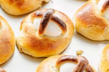 This Easter Breads recipe produces a billowy soft, golden and lightly sweet Easter bun with a perfectly cooked egg. Beautiful way to share the Easter story!