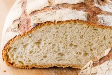 This Crusty French Bread is the perfect blend of chewy and super soft. Learn the secret to the crispiest crust that crackles and crunches as you slice.