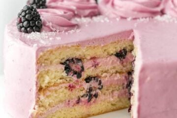 Soft and moist blackberry cake with fluffy blackberry lemon buttercream frosting. This blackberry lemon cake is sweet and tart with plenty of juicy berries!