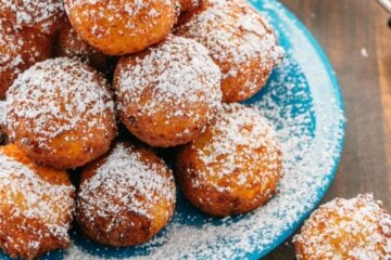 Billowy soft and lightly sweet Donut Holes (Russian Ponchiki). These donut holes are made with cheese giving them unforgettable flavor. Easy donut recipe!