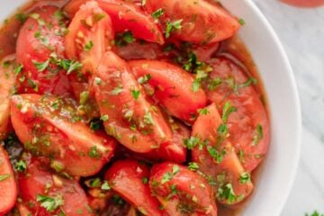 Addictively delicious! Served these marinated tomatoes at a potluck and everyone wanted the recipe! Marinated tomatoes are a great make-ahead side dish.