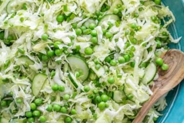 This cabbage and pea salad is vibrant, crisp and fresh. I love the sweet pop of flavor from the peas and the easy zesty dressing. A must try cabbage salad! | natashaskitchen.com