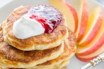 Apple and cheese pancakes are so light and fluffy. Serve these Ukrainian cheese pancakes with jam and sour cream for an unforgettable breakfast!