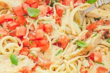 This chicken pasta has a creamy and light tomato alfredo sauce. The sauce has very little cream but it tastes gourmet! An easy chicken pasta recipe. | natashaskitchen.com