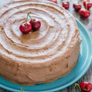 Decadent but simple chocolate cherry cake. Kirsch and cherries amplify chocolate in an intense and delicious way. The moist filling in this chocolate cake will surprise you! | natashaskitchen.com