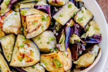 Spicy eggplant is my all-time favorite eggplant recipe. Hands down. Ogoniok (Огонек) means "little fire." Must-try eggplant recipe from the old country! | natashaskitchen.com