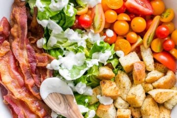 A BLT Salad loaded with fresh lettuce, crispy bacon, bright tomatoes, crunchy croutons and the BLT Salad dressing is exceptional. Easy, excellent salad! | natashaskitchen.com
