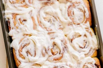 Melt-in-you-mouth overnight cinnamon rolls with whipped cream cheese icing. Perfect for holidays and busy mornings. The best make-ahead cinnamon rolls! | natashaskitchen.com